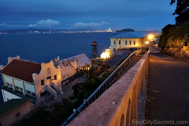 Night tour on Alcatraz, view of old fort and bay lights.