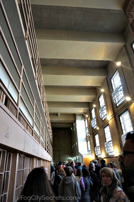 Crowds in Alcatraz cell block corridor, night tour