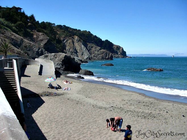 China Beach in San Francisco, kids playing on a sunny day