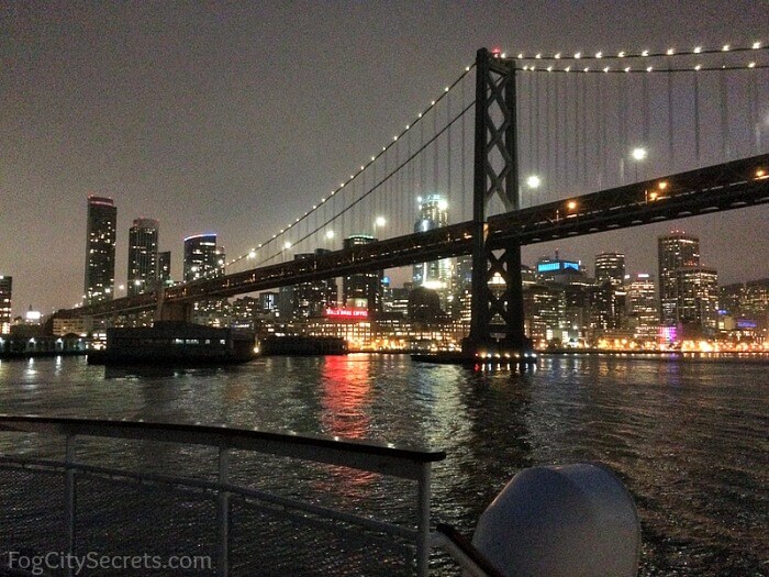 SF dinner cruise, city and bridge lights.